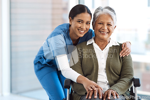 Image of Portrait, medical or disability with a nurse and old woman in a wheelchair during a nursing home visit. Smile, healthcare or retirement with a happy female medicine professional and senior client