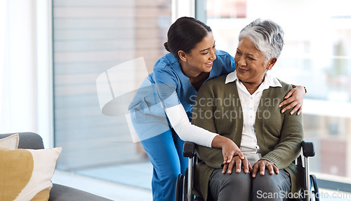 Image of Hug, nurse with senior woman in wheelchair and talking for support. Happy, smile and communication with female nurse holding disabled senior patients hand for caregiver in nursing home consulting