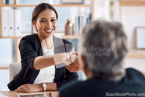 Image of Business, handshake and women in a meeting, planning and project development with consultation, brainstorming and onboarding. Female person, employee or staff shaking hands, negotiation or discussion