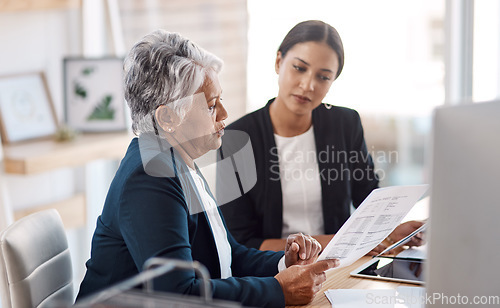 Image of Mentoring, teaching or business women with documents talking, speaking or planning project in office. Paperwork, teamwork collaboration or senior manager reading with intern worker for admin coaching