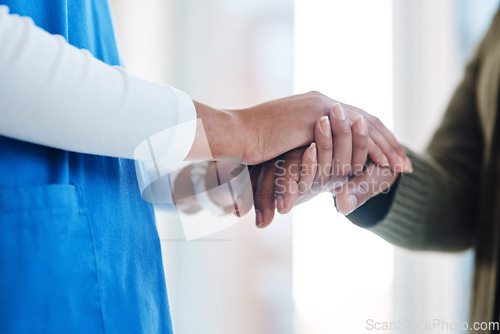 Image of Woman, holding hands or consulting a nurse for support or empathy for healthcare service of cancer therapy. Closeup, psychology clinic or sick patient in counseling with a caregiver in consultation