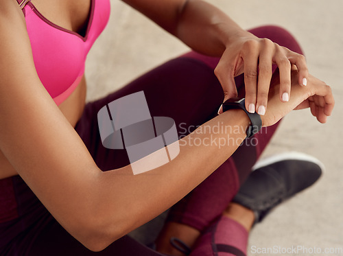 Image of Woman, hands and fitness checking smart watch for tracking, heart rate or steps of runner outdoors. Hand of fit or active female person looking at wristwatch for monitoring performance or wellness