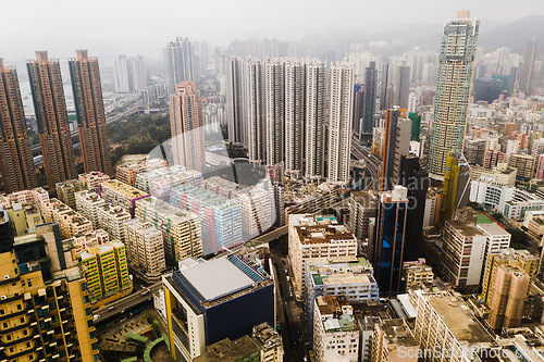 Image of Architecture, skyscraper cityscape and aerial view of buildings in Hong Kong with fog. Urban landscape, city building skyline and drone shot of skyscrapers and property in central business district.