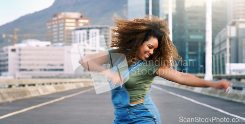 Image of Dance, happy and a woman in the city street for hip hop, freedom and talent. Smile, excited energy and a young dancing girl in an urban road with creativity, action and happiness with movement