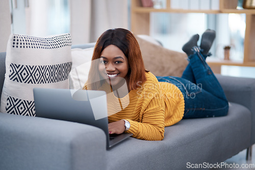 Image of Black woman with laptop, portrait and relax on sofa, search online for movie and streaming subscription at home. Happy African female person in apartment, connectivity and watching on pc with web