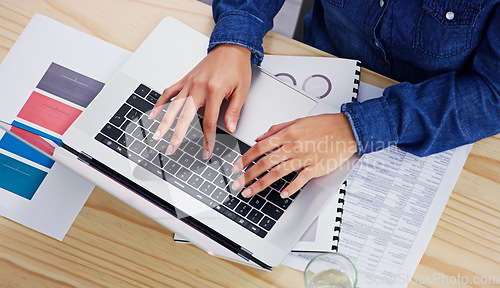 Image of Hands, laptop and finance from above with a business woman typing on a keyboard in her accounting office. Computer, documents and financial budget with an employee planning an investment strategy