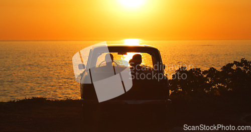 Image of Beach, silhouette and people in car at sunset for freedom, travel or road trip together. Dark, summer and friends in transport in the evening at the ocean for a date, vacation or adventure by the sea
