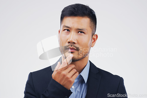 Image of Thinking, planning and an Asian businessman with ideas isolated on a white background in a studio. Idea, business and a corporate employee with a choice, decision or remember question on a backdrop