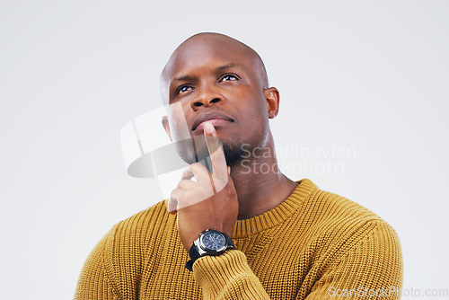 Image of Thinking, idea and a black man with focus for a decision isolated on a white background in a studio. Planning, young and an African person with ideas, remember plan and a choice on a backdrop