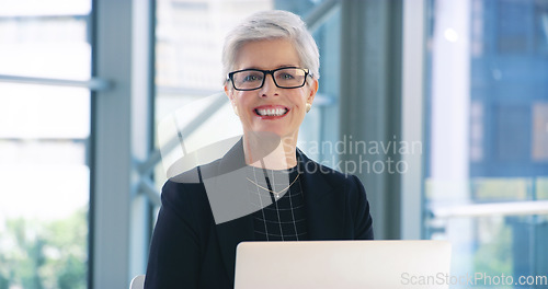 Image of Portrait, laptop and business woman, lawyer or professional in office workplace. Face, glasses and smile of female legal executive, senior entrepreneur or ceo from Canada with pride for career or job