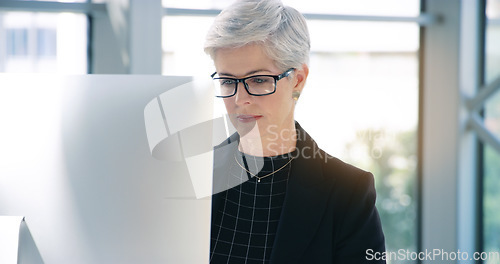 Image of Email, business and a woman with a computer in an office for communication and administration. Corporate, internet and an employee with a pc for online work, reading information and connectivity