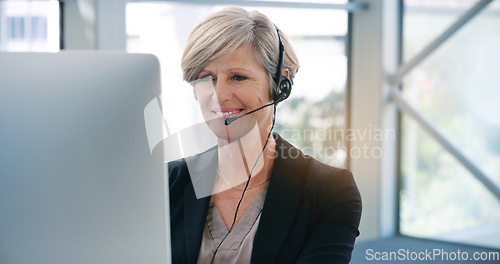 Image of Computer, video call and online meeting with a business old woman at work in her office for training. Desktop, virtual conference and seminar with a senior female manager or CEO sitting in a workshop