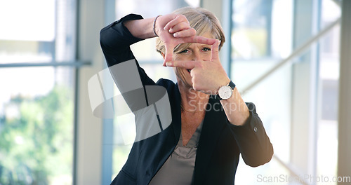 Image of Finger frame, portrait and businesswoman in the office with leadership, success and confidence. Happy, smile and professional senior female corporate employee with a border hand gesture in workplace.