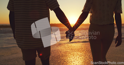 Image of Couple holding hands, beach at sunset and sea with back view, vacation and travel with man and woman outdoor. Love, romance and trust with people in commitment, tropical holiday and ocean waves