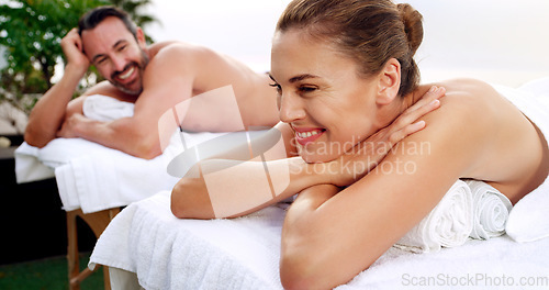 Image of Spa, relax and happy couple outdoor for massage, vacation and resting on a table with zen. Love, peace and man with woman at a luxury resort for wellness, treatment and body therapy, smile or bonding