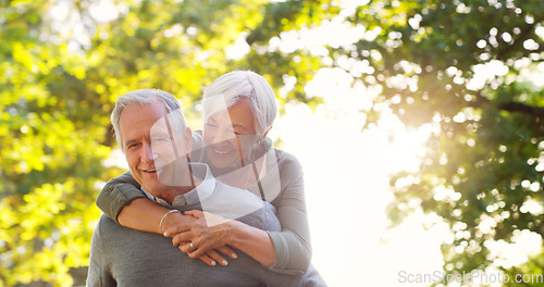 Image of Senior couple, piggy back and happy outdoor at a park with love, care and support. A elderly man and woman in nature for a fun walk, quality time and healthy marriage or retirement while playful