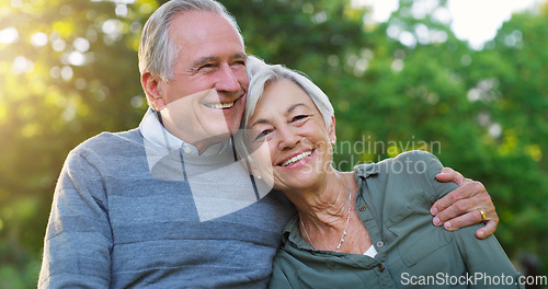 Image of Love, portrait and senior couple in a garden together hugging with care, happiness and romance. Smile, nature and elderly man and woman in retirement embracing while sitting in an outdoor green park.