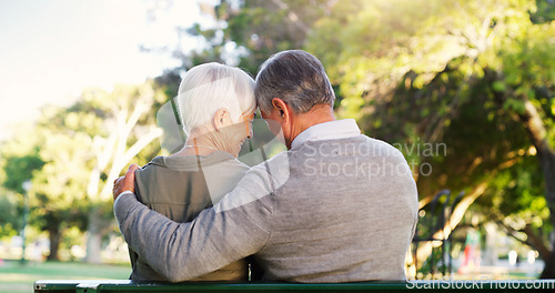 Image of Senior couple, hug and bench outdoor in a park with love, care and support in marriage. A elderly man and happy woman in nature with a smile for quality time, healthy retirement and freedom to relax