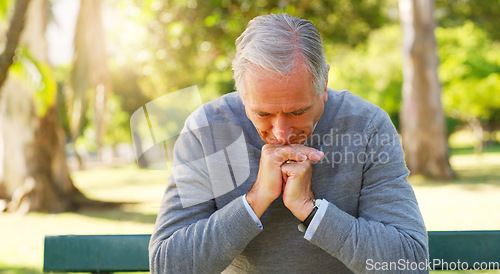 Image of Stress, thinking and senior man in a park sitting on a bench with a contemplating face and hand gesture. Nature, outdoor and elderly male person in retirement in a garden with a thoughtful expression