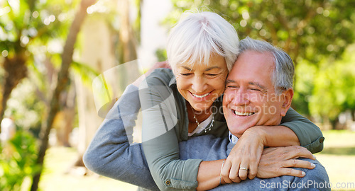Image of Love, hugging and elderly couple in a garden together with care, happiness and romance. Smile, nature and senior man and woman in retirement embracing, laughing and sitting in an outdoor green park.