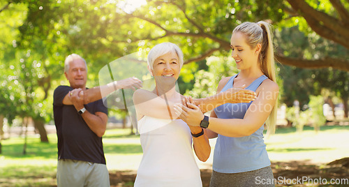 Image of Yoga, exercise and an old couple with their personal trainer in a park for a health or active lifestyle. Fitness, wellness or zen and senior people outdoor for a workout with their pilates coach