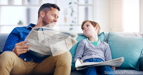 Image of Father, child and reading newspaper on sofa relaxing together in the living room at home. Happy dad and kid enjoying the news in relax on lounge couch for knowledge on weekend or holiday at the house