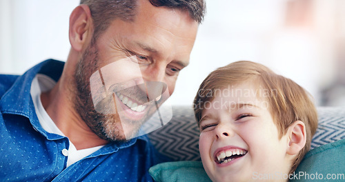 Image of Love, father and son laughing on sofa in living room of their home. Happiness or caring, positivity and excited or cheerful family on couch for funny joke or bonding time together at their house