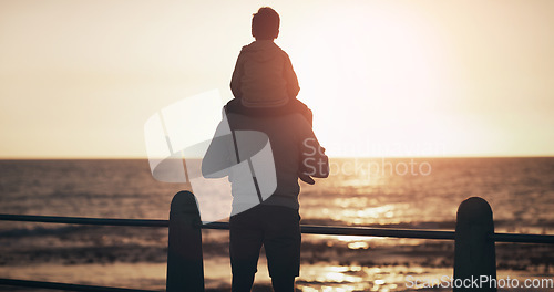 Image of Father, child and back in sunset by the ocean for family bonding, playing or fun holiday or weekend in nature. Dad carrying kid on piggyback by beach coast enjoying sunrise or travel together outdoor