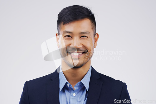 Image of Portrait, business and Asian man with a smile, lawyer and confident guy against a grey studio background. Face, male person and employee with happiness, agent and career development with professional