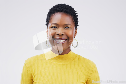 Image of Happy, smile and portrait of a black woman with a headshot isolated on a white background in a studio. Happiness, business and face of a young African employee smiling for a corporate profile