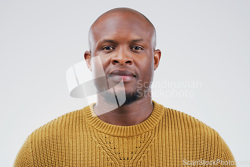 Image of Face portrait, serious and black man in studio isolated on a white background. African, bald and male person from South Africa with fashion, style and pose with aesthetic clothes for confidence.