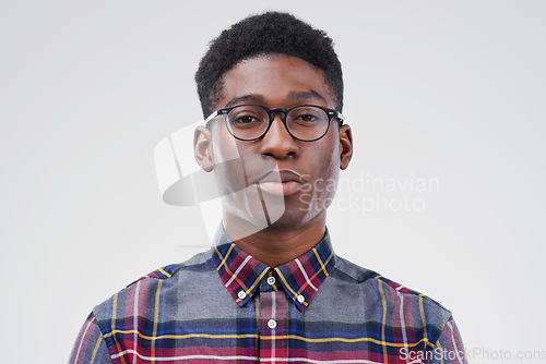 Image of Face portrait, serious geek and black man in studio isolated on white background. African, nerd and male person with glasses from South Africa with fashion, style and pose with clothes for confidence