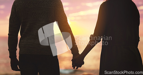 Image of Couple, holding hands and sunset beach sky with love on vacation, holiday or adventure. Silhouette of man and woman together for freedom, marriage and travel journey or commitment outdoor in nature