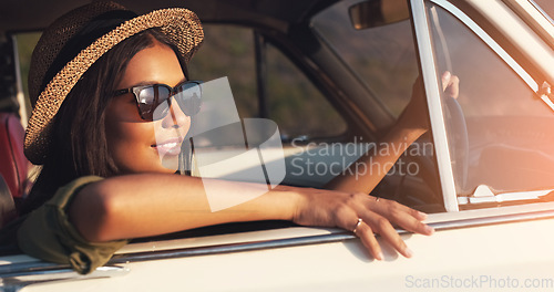 Image of Road trip, car window and flare with a woman enjoying travel or freedom on a joy ride as a tourist. View, sunset and relax with a young female traveler taking a drive alone outdoor for adventure