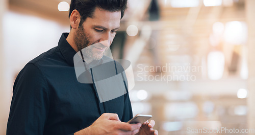 Image of Business man, texting and phone with space in office mockup for networking, chat and email communication. Businessman, smartphone and focus for schedule, notes and social network app in workplace