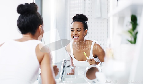 Image of Woman check teeth in mirror, cleaning mouth with toothbrush and toothpaste, morning routine in bathroom. Dental, health and oral hygiene, female person grooming with fresh breath and wellness at home