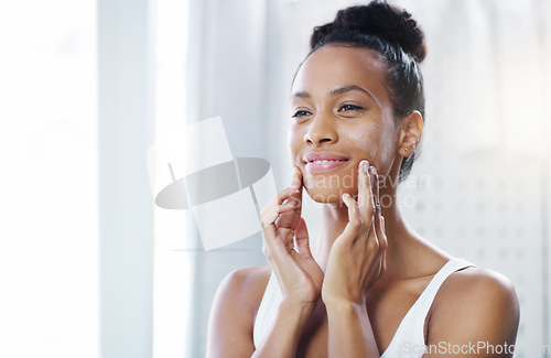 Image of Woman, face and mirror with lotion for beauty, moisturizer and cosmetic product with morning routine in bathroom. Female person apply cream to skin, skincare and dermatology at home with mockup space