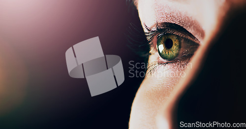 Image of Woman, face and closeup of eye on mockup space for vision or sight against a dark background. Female person with eyelashes and green or hazel eyes looking in perception, eyesight or light on mock up