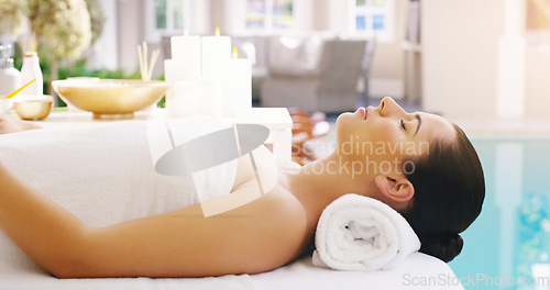 Image of Woman, relax and massage bed at spa for zen, physical therapy or healthy wellness at a resort. Calm female person, sleeping or relaxing in peace, luxury body treatment or self love at hotel or salon