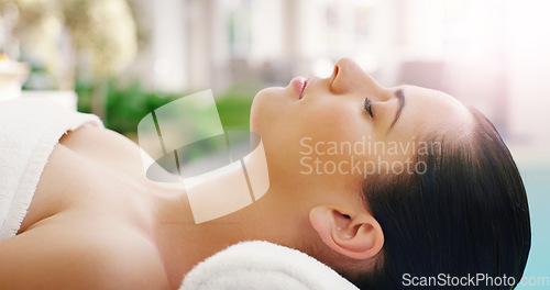 Image of Woman, relax and face sleeping at spa for zen, physical therapy or healthy massage on bed at resort. Calm female person relaxing in peaceful sleep for luxury body treatment or self love at the salon