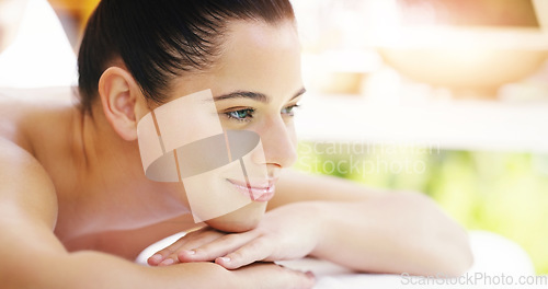 Image of Happy woman, relax and smile in massage at spa for healthy wellness, zen or physical therapy treatment. Female person smiling and relaxing on table for self care, body or stress relief at the salon