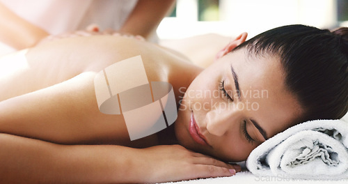 Image of Woman, relax and sleeping in back massage at spa for healthy wellness, skincare or stress relief at a resort. Calm female person relaxing asleep in peaceful zen or luxury body treatment at the salon