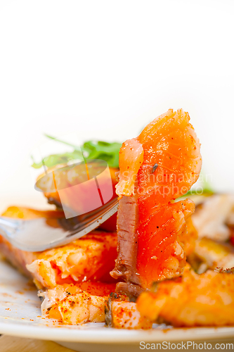 Image of grilled samon filet with vegetables salad