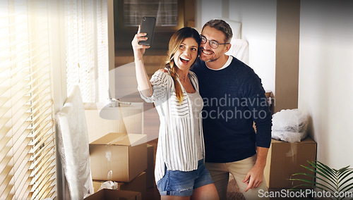 Image of Couple, moving and box with selfie, new house or excited for start, love or beginning in real estate. Man, woman and happy with smile, photography and profile picture for home, property or apartment