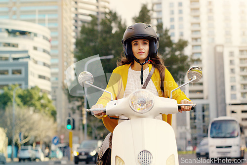 Image of Woman, motorbike and transport in city, street and safety with helmet, journey or travel in summer sunshine. Girl, motorcycle and outdoor in metro for transportation, vacation and freedom on road