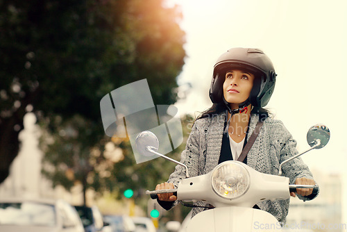 Image of Woman, motorcycle and transport in city, street and safety with helmet, journey and travel with mock up space. Girl, motorbike and scooter in metro cbd with thinking, vacation and freedom in traffic