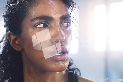 Image of Sweating, woman and breathing while taking a break from fitness, exercise and workout. Gym, Indian female person and serious face of an athlete after sports and wellness club training for health