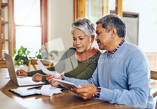 Image of Senior couple, budget planning and health insurance checklist with computer at home. Documents, pension and elderly people with financial, tax and debt form in a house with bills and pc admin