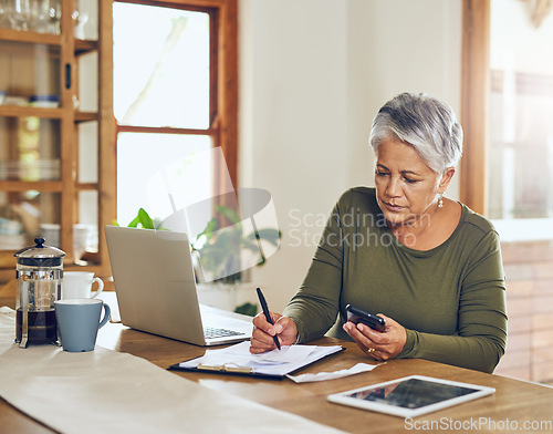 Image of Senior woman, budget planning and health insurance checklist with phone at home. Writing, contract and elderly female person with financial, tax and pension form in a house with bills and debt