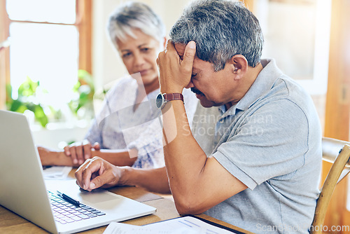 Image of Finance, stress and senior couple with worry for bills, debt paperwork and documents for pension. Retirement, anxiety and elderly man and woman on laptop for mortgage payment, investment and budget